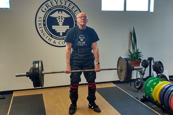 elderly lifter locking out a deadlift at greysteel