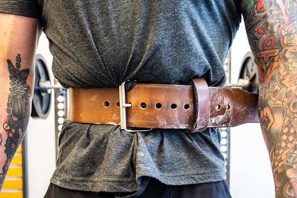 close up of a weightlifting belt around a lifter