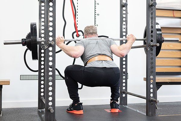 lifter at the bottom of a squat