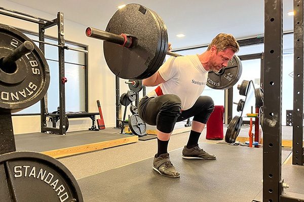 steve ross pauses at the bottom of a squat