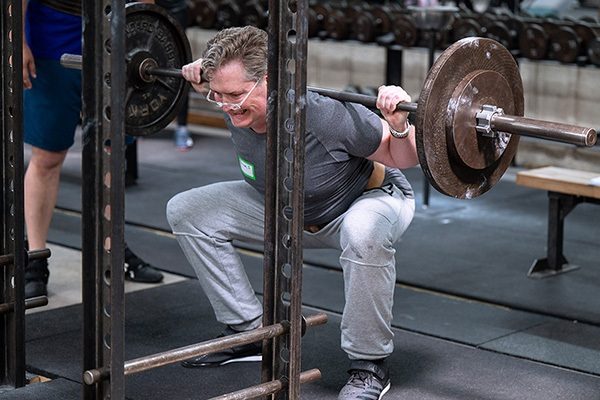 lifter in the bottom of the squat