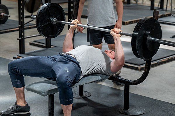 lifter in the middle of a bench press