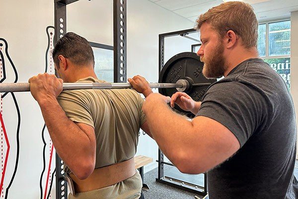 andrew lewis coaches the squat at starting strength indianapolis