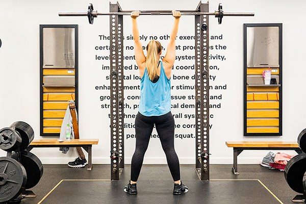 female lifter pressing