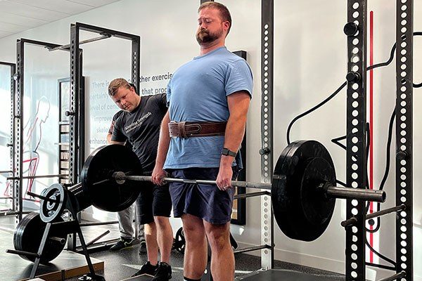 andrew lewis coaching a deadlift at starting strength indianapolis