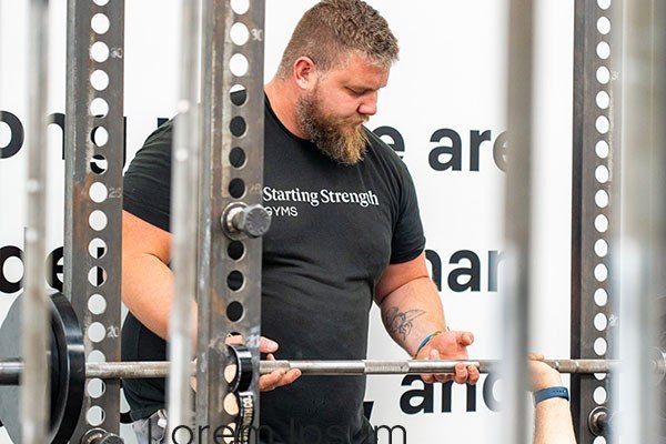 tyler perkins spotting the bench press at starting strength tampa