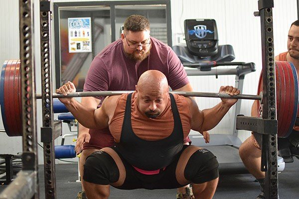 carl raghavan at the bottom of a warmup squat