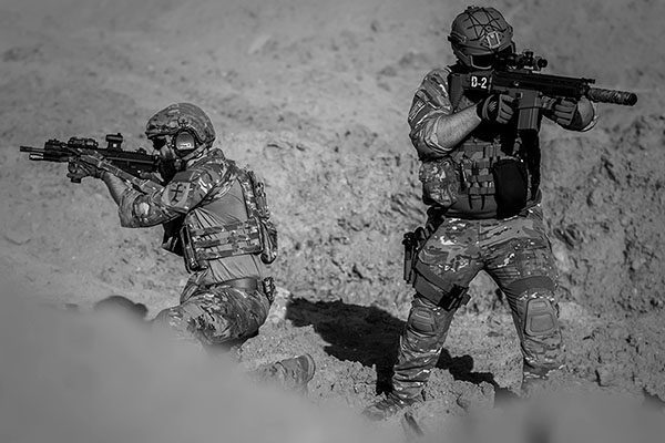 troops in the mud with weapons