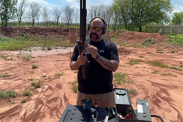 nick delgadillo loading a shotgun