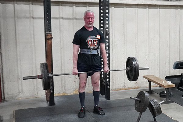 john klein locks out a deadlift at a starting strength seminar