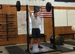 Brendan works on his barbell press