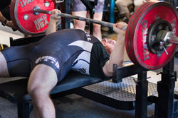 Sean Stangl bench pressing 180 kg