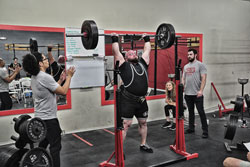 Christopher Popovich locks out a 320 lb Press