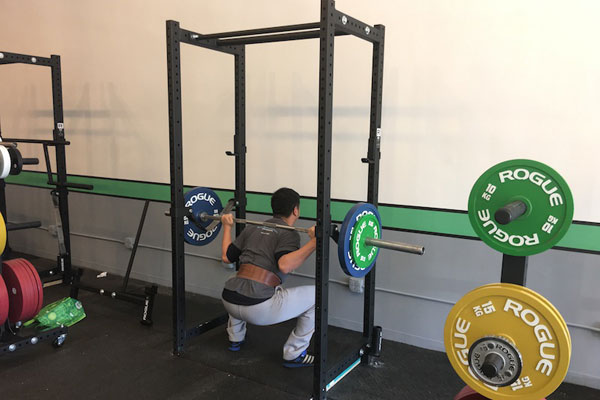chris squatting in the new gym